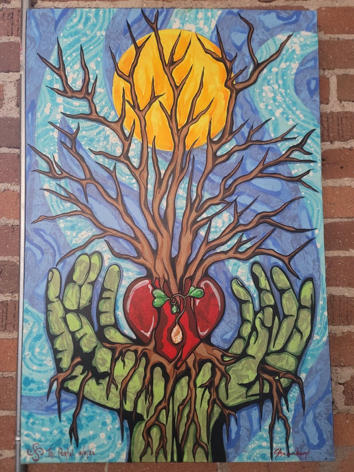 A bare tree growing out of a red heart cradled in two green hands, beneath a yellow sun in a swirling blue sky.